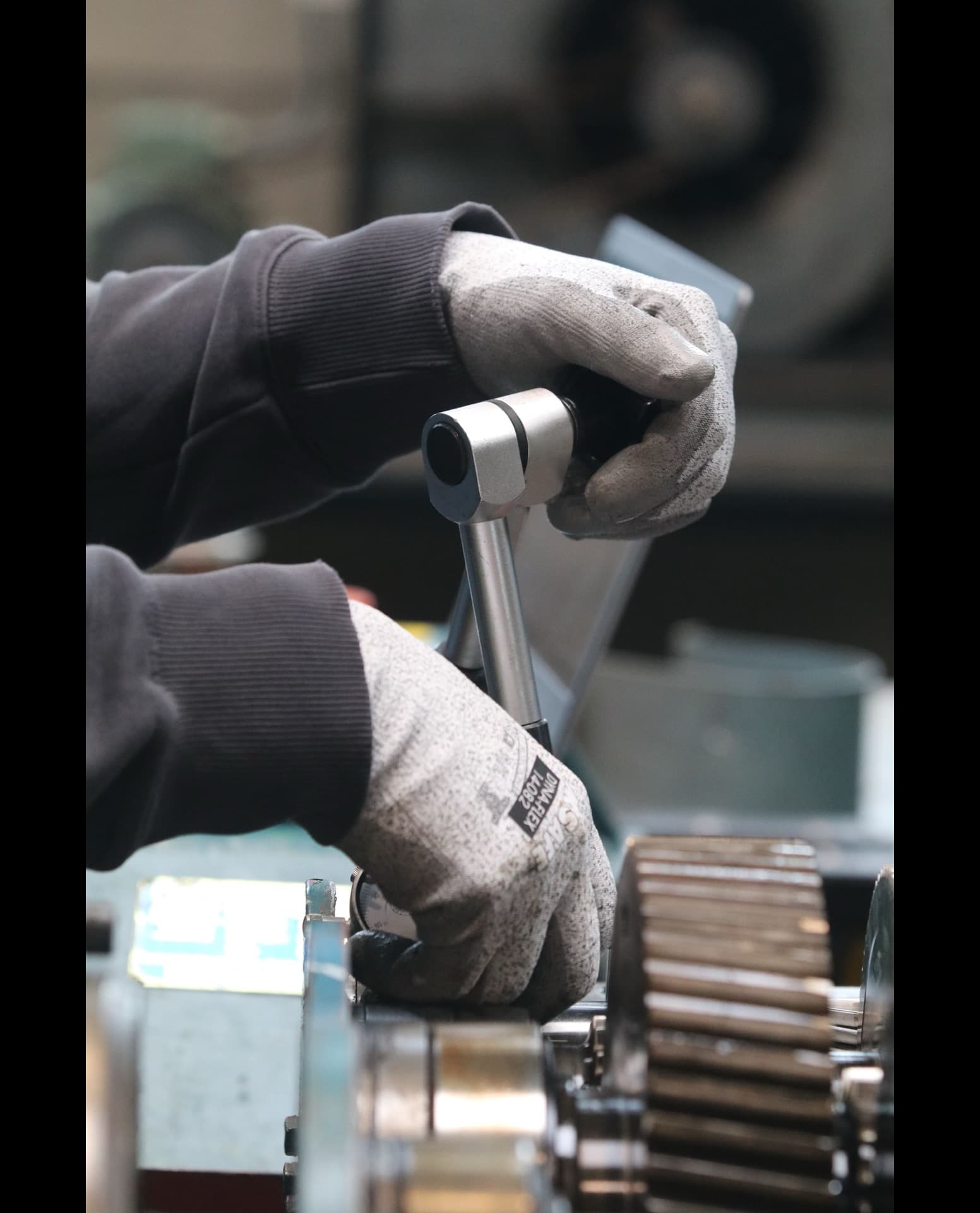NDT technician performing ultrasonic testing on a pressure vessel weld at an industrial facility